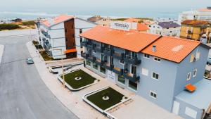 an overhead view of a building with an orange roof at Pedrógão Guesthouse in Pedrógão