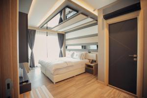 Postel nebo postele na pokoji v ubytování Burhaniye Marina Boutique Hotel