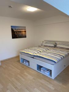 Кровать или кровати в номере Ferienwohnung Am Kurpark in Bad Rothenfelde