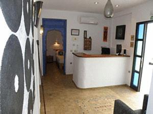 Televízia a/alebo spoločenská miestnosť v ubytovaní Hostal Extramuros + 37 fotografií