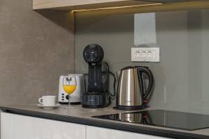 Příslušenství pro přípravu čaje a kávy v ubytování Apartment SABBIA