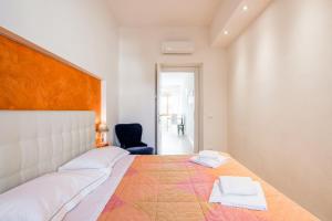 Ένα ή περισσότερα κρεβάτια σε δωμάτιο στο Santa Maria Novella Cozy Flat