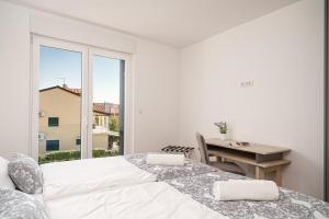 Postel nebo postele na pokoji v ubytování Apartment SABBIA