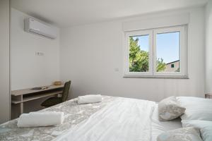 Postel nebo postele na pokoji v ubytování Apartment SABBIA