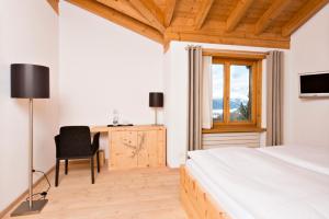 Rúm í herbergi á Berghotel Randolins
