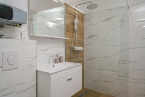 Koupelna v ubytování Apartment SABBIA + 28 fotografií