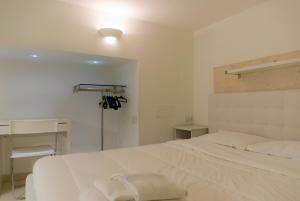 Postel nebo postele na pokoji v ubytování White albergo diffuso Ristorante & SPA