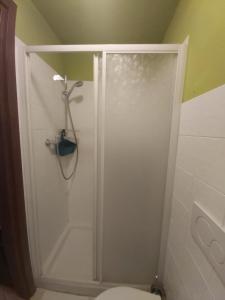 a white shower in a bathroom with a toilet at LODGING 5 TERRE & PORTO LA SPEZIA in La Spezia