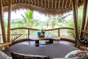 Ein Balkon oder eine Terrasse in der Unterkunft Magic Hills Bali - Angel House Magical Eco Lodge