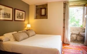 Ένα ή περισσότερα κρεβάτια σε δωμάτιο στο Pazo da Touza