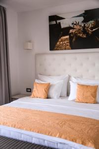 Cama ou camas em um quarto em Forte Rose Hotel