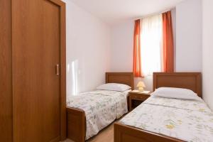 Posteľ alebo postele v izbe v ubytovaní Marija F4 Apartment