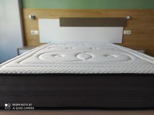 A bed or beds in a room at Habitaciones Barra89