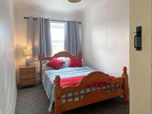 A bed or beds in a room at Cottage 429 - Ballyconneely