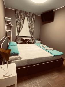 Postel nebo postele na pokoji v ubytování Affittacamere da Jasmina Venzone + 35 fotografií