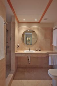 a bathroom with a sink and a mirror at Elviria Hills Living in Marbella