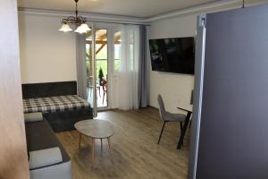 a living room with a couch and a table at Vyhlídka Slapy Nová Živohošť in Křečovice