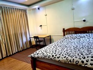 Ein Bett oder Betten in einem Zimmer der Unterkunft T2B Hostel