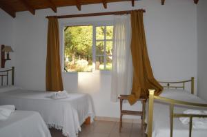 Ένα ή περισσότερα κρεβάτια σε δωμάτιο στο Hosteria Magdalena +36 φωτογραφίες