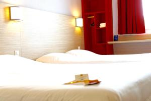 Letto o letti in una camera di Première Classe Lyon Sud - A7