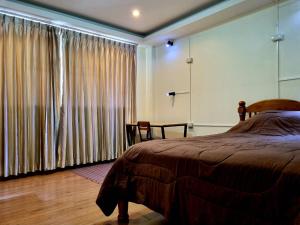 Ein Bett oder Betten in einem Zimmer der Unterkunft T2B Hostel