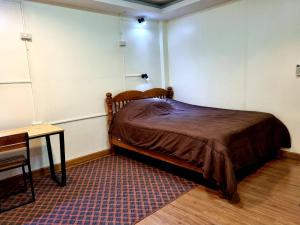 Ein Bett oder Betten in einem Zimmer der Unterkunft T2B Hostel