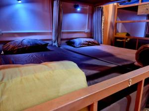 Ein Bett oder Betten in einem Zimmer der Unterkunft T2B Hostel