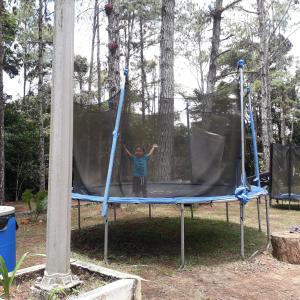 a person is standing on a trampoline at Cabañas en Los Altos de cerro Azul Panamá Cascadas RIos Naturaleza viva in Los Altos de Cerro Azul