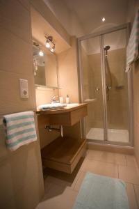a bathroom with a sink and a shower at Hotel-Gasthof zum Bach in Neukirchen beim Heiligen Blut