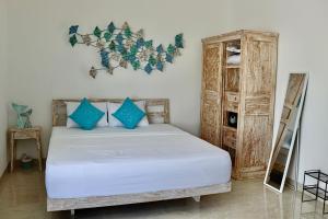 Ein Bett oder Betten in einem Zimmer der Unterkunft Ocean Star Apartment Sanur