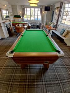 a living room with a pool table in it at Woolpack Inn in Chichester
