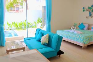 Ein Bett oder Betten in einem Zimmer der Unterkunft Ocean Star Apartment Sanur