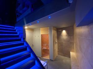 a staircase leading to a bathroom with a shower at White albergo diffuso Ristorante & SPA in Foggia