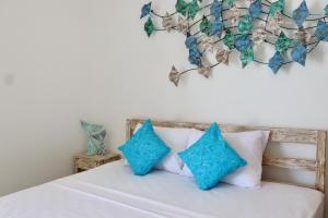 Ein Bett oder Betten in einem Zimmer der Unterkunft Ocean Star Apartment Sanur