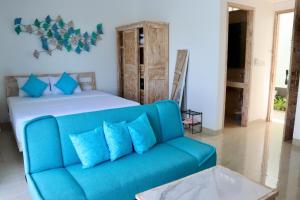 Ein Bett oder Betten in einem Zimmer der Unterkunft Ocean Star Apartment Sanur