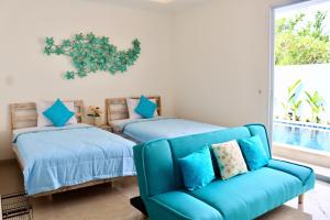 Ein Bett oder Betten in einem Zimmer der Unterkunft Ocean Star Apartment Sanur