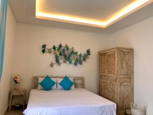 Ein Bett oder Betten in einem Zimmer der Unterkunft Ocean Star Apartment Sanur