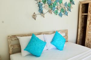 Ein Bett oder Betten in einem Zimmer der Unterkunft Ocean Star Apartment Sanur