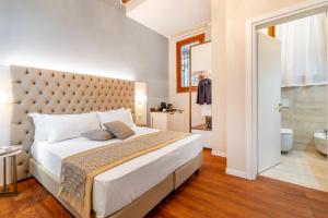 Posteľ alebo postele v izbe v ubytovaní Residenza La Duchessa Deluxe Rooms