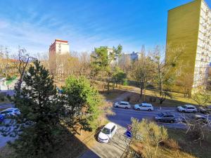 a parking lot with cars parked in a city at Apartment Hroncová, near city centre and park, quiet location in Košice