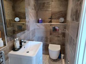 A bathroom at Stylish coastal retreat in St Ives