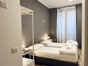 A bed or beds in a room at QUO Milano
