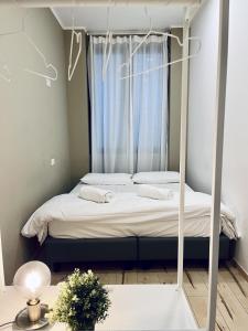 A bed or beds in a room at QUO Milano