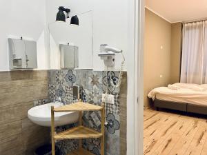 A bed or beds in a room at QUO Milano