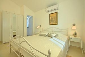 Posteľ alebo postele v izbe v ubytovaní Villa Larisa + 24 fotografií