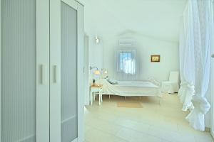Posteľ alebo postele v izbe v ubytovaní Villa Larisa