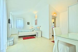 Posteľ alebo postele v izbe v ubytovaní Villa Larisa