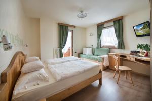 Postel nebo postele na pokoji v ubytování Hotel Garnì COSTANZA + 37 fotografií