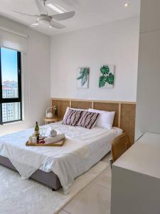 Кровать или кровати в номере Kenwingston Skyloft Apartment Doorsteps to BRT Subang USJ