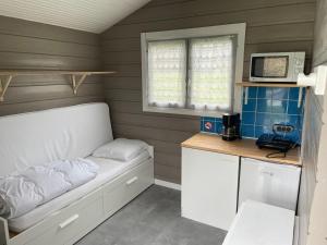 TV a/nebo společenská místnost v ubytování Camping Les Etoiles